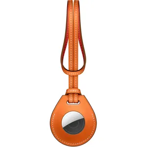 Orange leather loop detail for AirTag tracking device key ring holder accessory display.