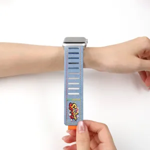 Denim Apple Watch band replacement strap with Velcro closure and colorful stitching for watch.