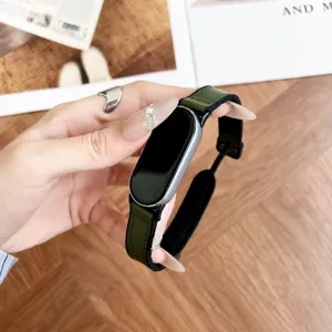 Green silicone replacement watch strap with napa texture and magnetic folding clasp for smart band.