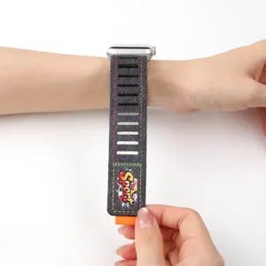 Denim Apple Watch band compatible with smartwatches, featuring breathable slots and velcro.