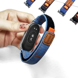 Detailaufnahme von Jeans-Smartwatch-Ersatzarmband mit Klettverschluss und Leder-Etikett.