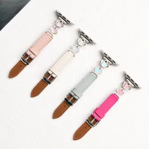 Leather watch strap with metal heart charms compatible with Apple Watch women accessories.