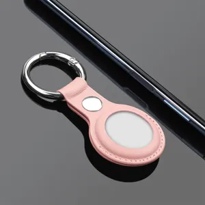 Pink leather case for AirTag with keychain, premium protective cover for tracker accessories.