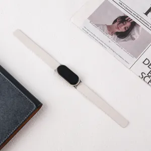 Replacement leather magnetic strap for smart fitness band, elegant minimalist design.