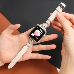 Detailed view of women metal heart leather watch band replacement accessory strap elegant.