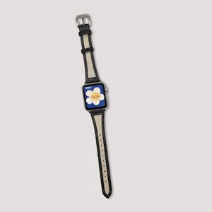 Detail view of compatible leather and canvas watch strap for Apple Watch, black design.