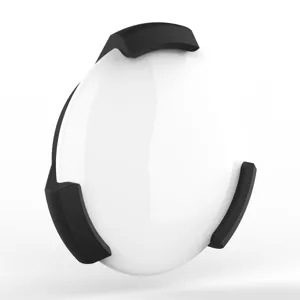 Magnetic protective case detail shot for Apple AirTag tracker, sleek black and white design.