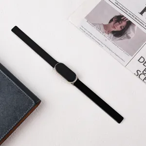 Close-up detail of the black leather smart watch strap featuring fine texture and metal connector.