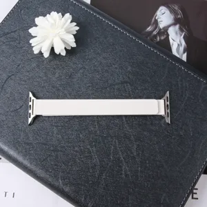 White magnetic leather watch strap detail shot, premium replacement smart band accessory.
