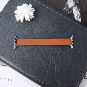 Brown leather magnetic smartwatch replacement strap detail, stylish accessories for smart bands.