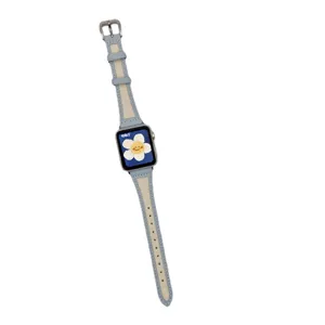 Replacement leather and canvas watch strap compatible with Apple Watch, stylish and durable design.