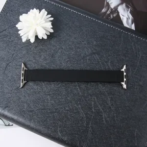 Black magnetic leather replacement smart watch strap with metal connectors, premium detail view.