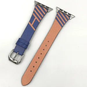 Leather replacement strap for Apple Watch, colorful striped design with metal buckle.
