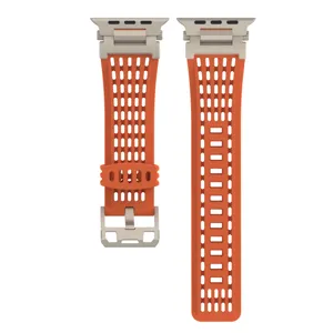 Vibrant orange perforated silicone watch band compatible with Apple Watch Ultra and Series.