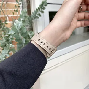 Elegant beige genuine leather replacement watch strap for smartwatches, stylish minimalist accessory.
