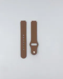 Vista detallada de la correa de reloj de repuesto de cuero marrón con botón a presión.