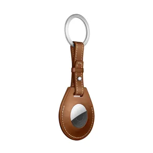 Premium brown leather keychain protective case detail view designed for Apple AirTag trackers.