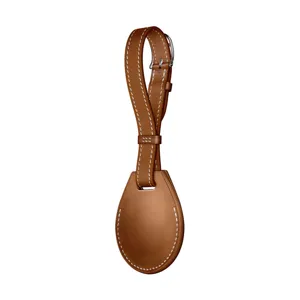 Brown leather protective case and keychain loop compatible with AirTag tracking devices.