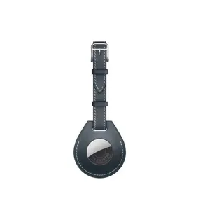 Leather protective case keychain detail view compatible with Apple AirTag tracker accessory.