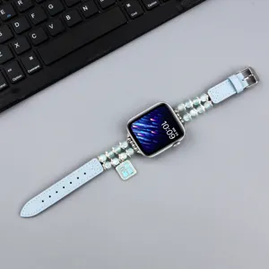 Bracelet en cuir perlé de rechange avec charm pour Apple Watch Series, design bleu élégant.