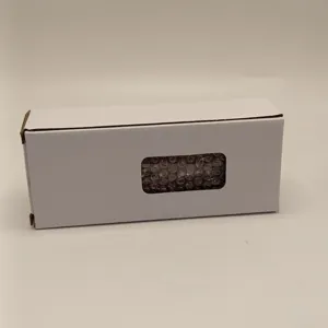 Detail view of white packaging box for cruise ship fluid drift bottle ornament securely.