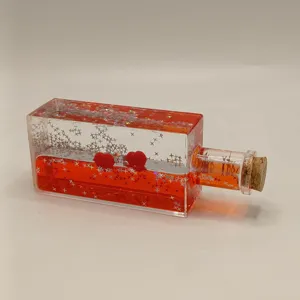 Liquid motion wave bottle creative desktop ornament with red glitter stars and cute hearts.