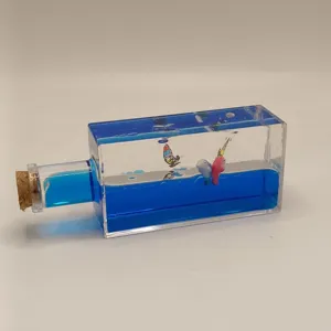 Creative liquid motion bottle desktop ornament, blue fluid drifting toy with mini boats.
