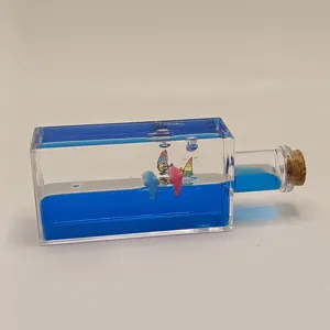 Liquid motion bubbler toy with blue oil wave and cute dolphins for desktop decor gift.