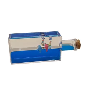 Acrylic liquid motion bubbler toy desktop ornament with blue oil and cute dolphin figurines.