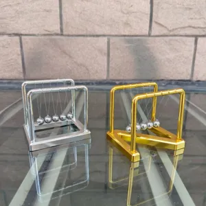 Metal Newton cradle balance balls detail view, desktop physics science toy ornament decoration