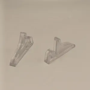 Transparent plastic display stand for photo frames, books, and plates. Durable bracket.