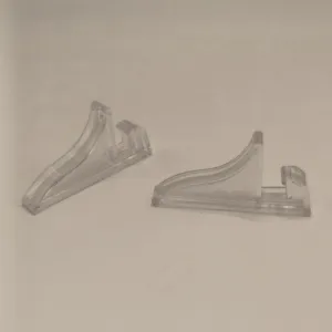 Clear plastic display stand detail showing transparent support bracket for frames and crafts.