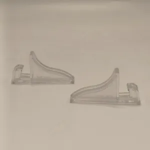Clear plastic display stand detail for picture frames and sand art ornaments holder.