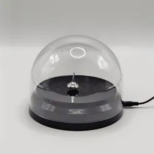 USB powered endless spinning top toy with clear protective cover and black base desk decor