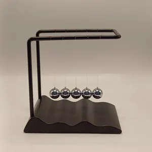 Newton's cradle balance balls with wavy black base, ideal desk decor and science toy gift.