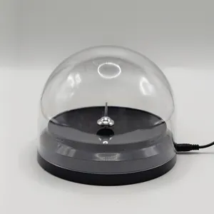 Detail shot of magnetic levitation spinning top with clear protective dome and USB cable.