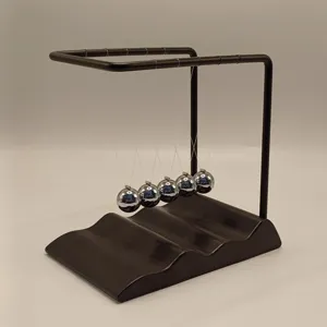 Detailed view of the wave base newton's cradle balance balls desk physics toy and home decor.