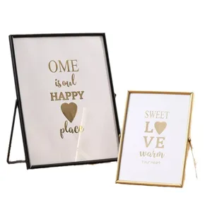 Modern metal photo frames set for table display, geometric picture frames with glass and stands.