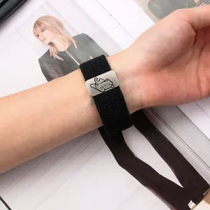 Detailed view of black elastic nylon braided watch band with cute cat metal buckle for smartwatch.