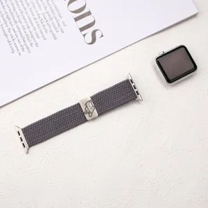 Grey nylon braided Apple Watch strap featuring cute cat metal charm, comfortable elastic band.
