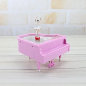 Pink piano music box with dancing ballerina figurine, perfect gift for birthday and home decor.