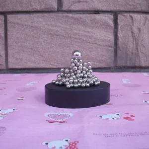 Close-up detail view of 171pcs silver magnetic balls metal sculpture displayed on base.