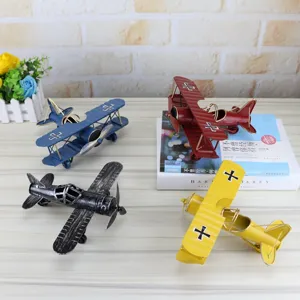 Retro handmade iron airplane model tabletop decor set of four colorful biplane ornaments.