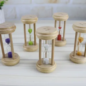 Wooden hourglass sand timer set with multi-color sand for home decor and time management.