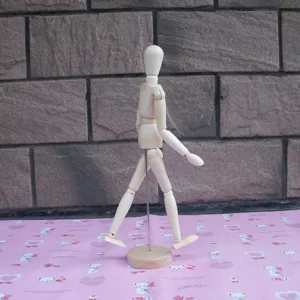 Wooden manikin model sketching art doll detail view, flexible joints for drawing practice.