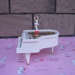 White piano music box with rotating ballerina girl figurine, perfect desktop ornament gift.