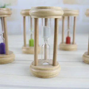 Detailed view of wooden hourglass timers with white and colorful sand, creative home decor.