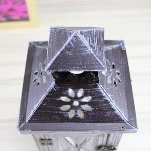 Detailed shot of vintage wooden candle lantern top, rustic retro design for home decor.