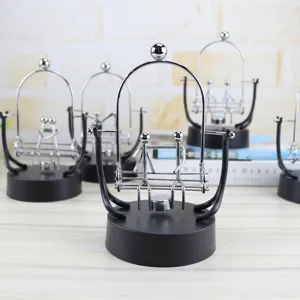 Detailed view of the creative metal balance swing perpetual motion desk toy decor.