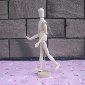 Wooden art mannequin jointed figure for sketching and drawing 33cm tall with stand base.